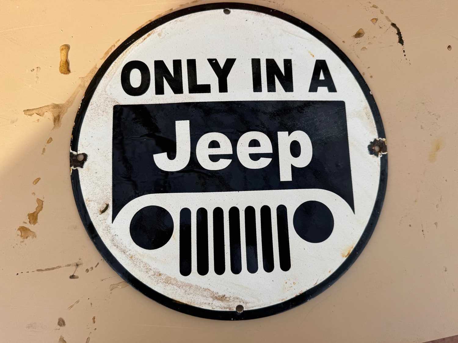 Lot 63 - ONLY IN A JEEP ENAMEL REPRODUCTION SIGN 12" DIA