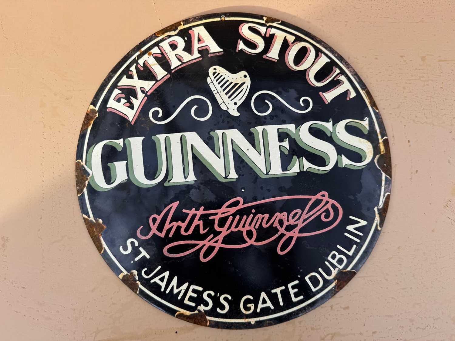 Lot 107 - GUINNESS EXTRA STOUT ENAMEL REPRODUCTION SIGN 12" DIA