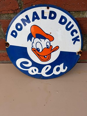 Lot 417 - DONALD DUCK COLA ENAMEL REPRODUCTION SIGN 12" DIA
