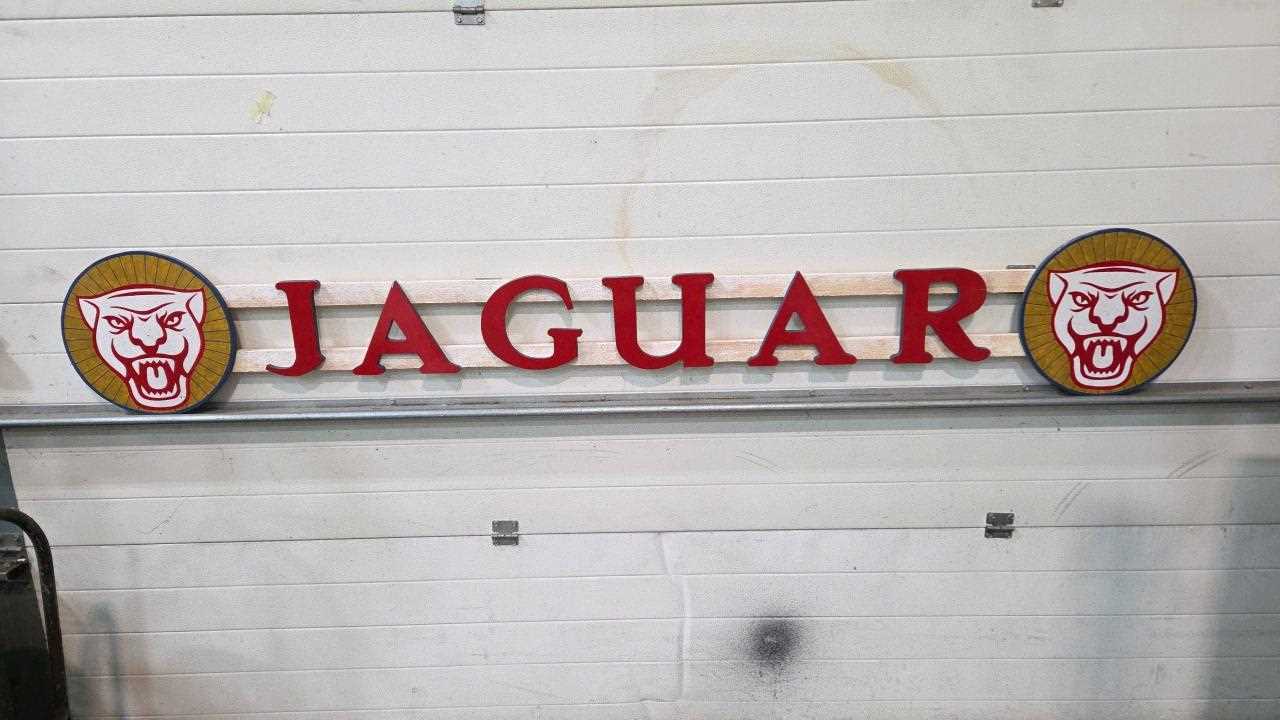Lot 31 - WOODEN HAND PAINTED JAGUAR SIGN 100" X 15"