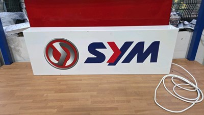 Lot 567 - SYM LIGHT UP SIGN 36" X 12"