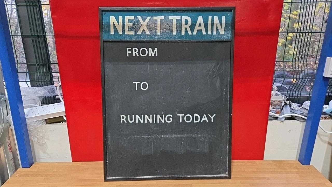 Lot 829 - TRAIN TIME TABLE SIGN 31
