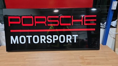 Lot 11 - PLASTIC PORSCHE MOTORSPORT SIGN 44" X 20"