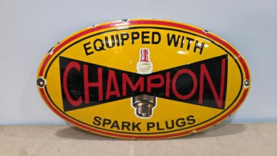 Lot 23 - EQUIPPED WITH CHAMPION SPARK PLUGS, REPRODUCTION ENAMEL SIGN 19" X 11"