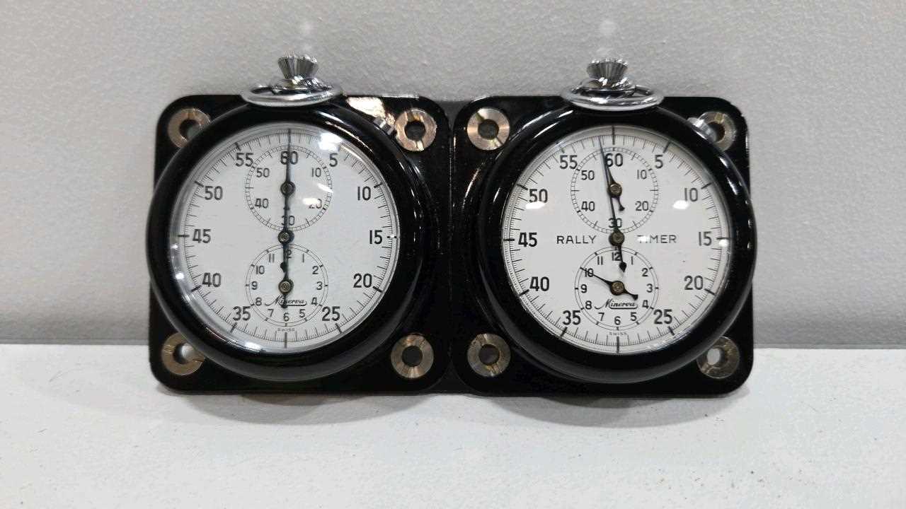 Lot 47 - TWIN MINERVA RALLY TIMER ON A METAL MOUNTING