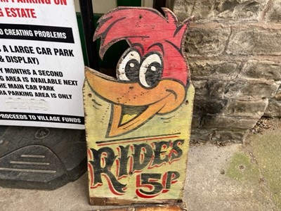 Lot 121 - WOODY WOODPECKER RIDES SIGN