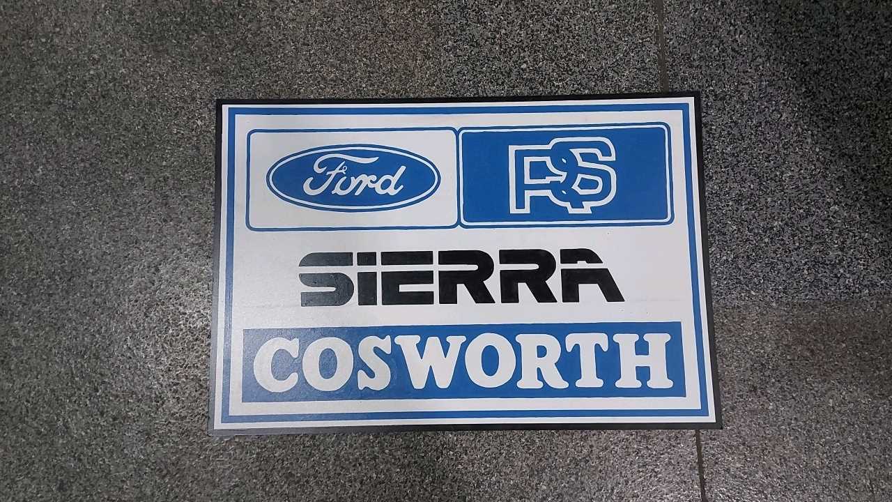 Lot 587 - SIERRA COSWORTH PAINTED WOODEN SIGN