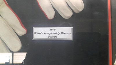 Lot 409 - FRAMED SIGNED FERRARI GLOVES - IRVINE & SCHUMACHER