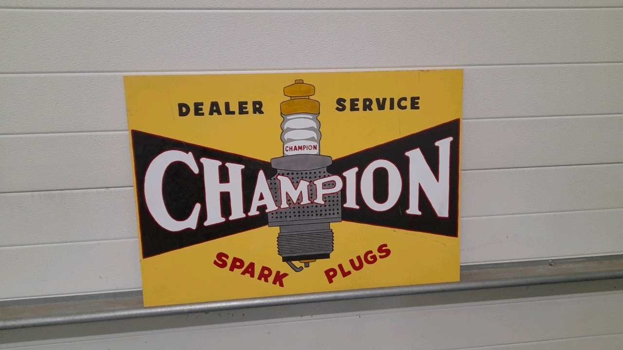 Lot 183 WOODEN HAND PAINTED WOODEN SPARK PLUG SIGN