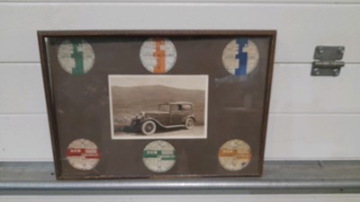 Lot 343 - FRAMED PHOTO  WITH TAX DISCS FROM 1929 TO 1934