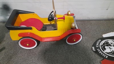 Red and yellow shop plastic pedal car